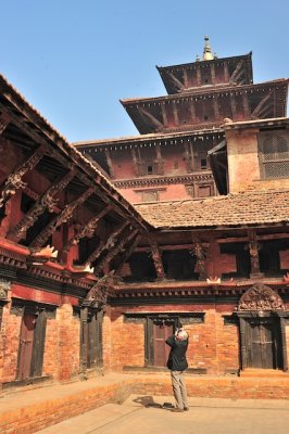 Karl photographs the images in the temple in Patan.