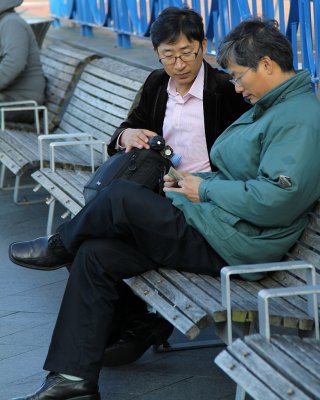 Tourists counting their money