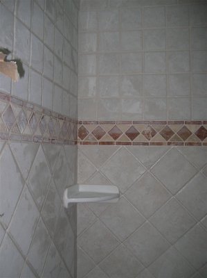 Grouting around soap dish