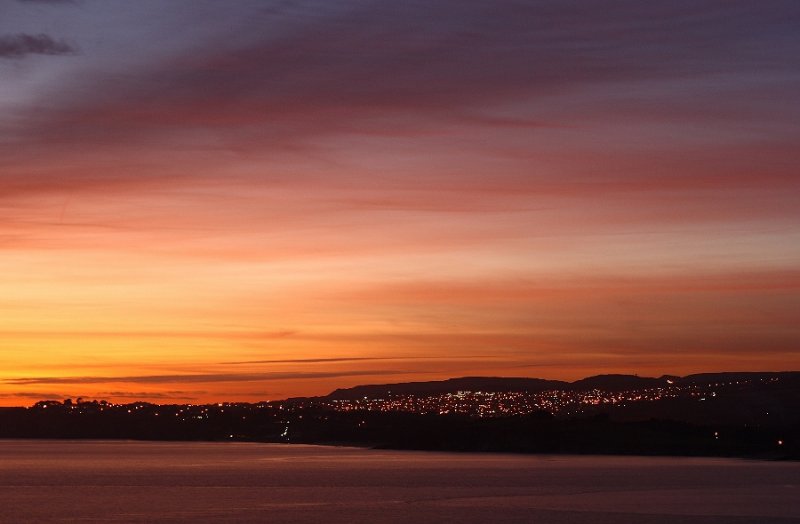 St Austell after sunset, from across the bay