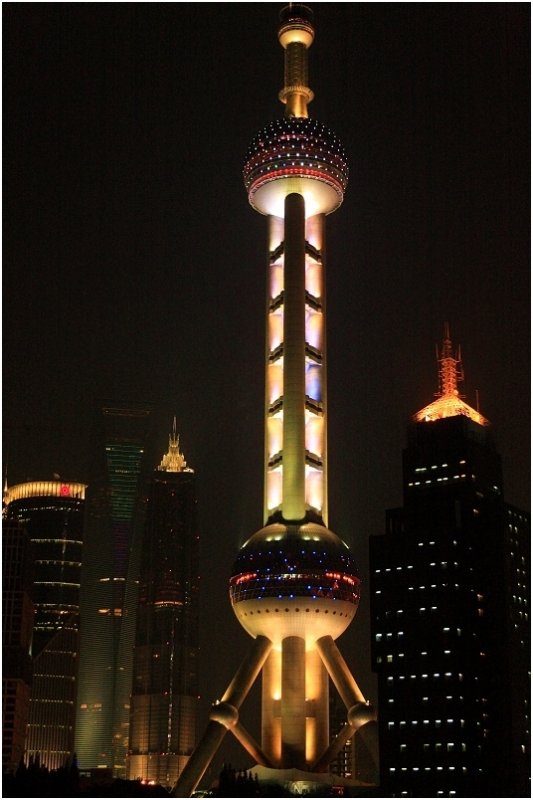 The Oriental Pearl TV Tower at night from the Huangpu River