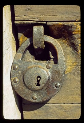 Several hundred year old lock on worn church door
