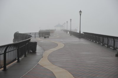A cold, rainy mist shrouded the two men on the fishing pier