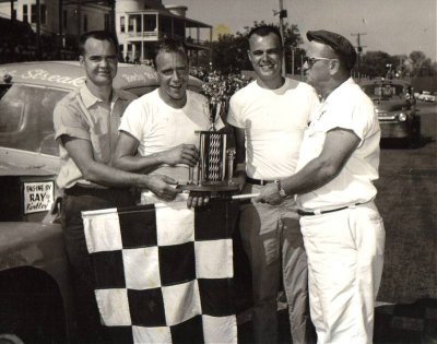 Ray, Charles, and Roy Binkley with flagman Forest   Prince. Win again.