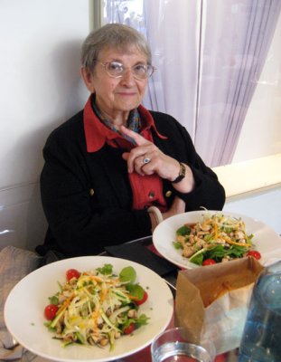 Chicken salad with bread in a brown paper bag