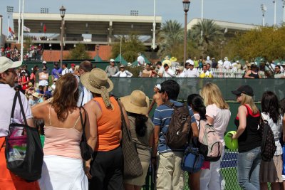 Tommy Haas surrounded by his fans mostly women yelling put your shirt on. ha ha