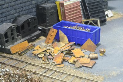 Close-up of new scrap pile & rust treatment