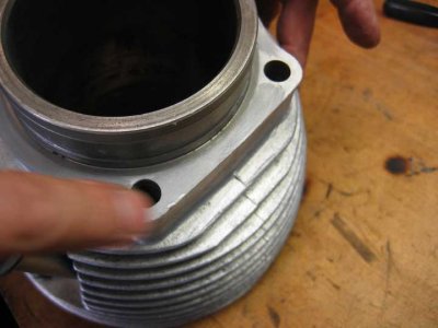 Applying sealant to cylinder base of jug.