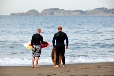 surfers at Baker Beach