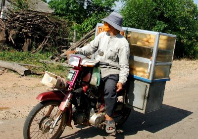 selling bread on scooter