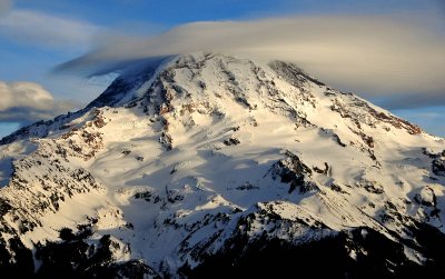 white hat over Mt Rainier