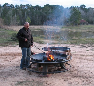 Jon getting the pit ready to cook steaks