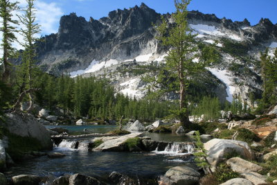 Water rushing forth from Leprechaun Lake, with McClellan Peak in distance