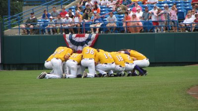 Team Bowing Their Heads