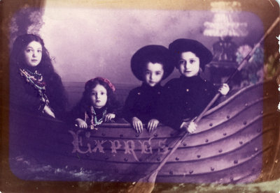 With her siblings in a boat  circa 1910