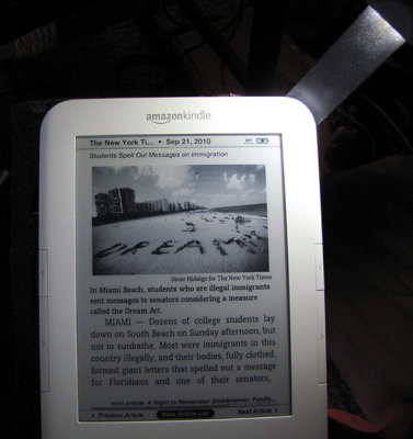 Kindle 3 lit by <a href=http://bit.ly/k3cvr-light target=_blank><u>cover w/ built-in light</u></a>