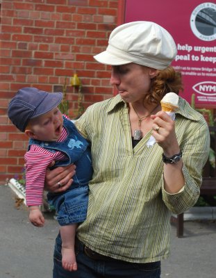 Is that a yawn or an attempt to eat mummy's icecream?