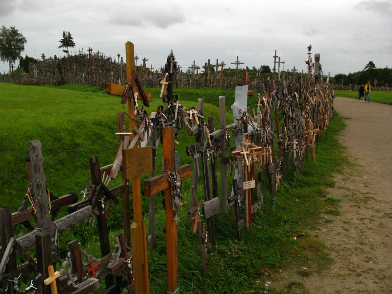 Rows of crosses leading up to the hill