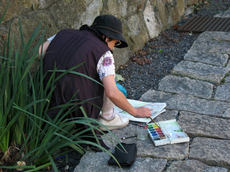 Woman painting a scene of the Hachiman moat