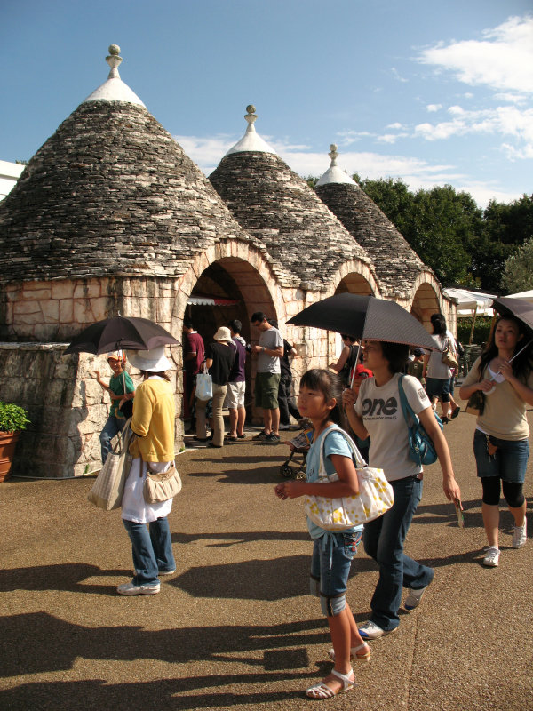 Japanese tourists and Alberobello house
