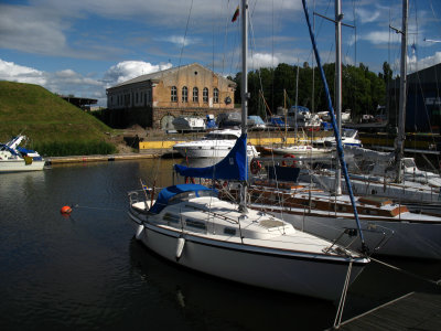 Boats on the moat with an old warehouse