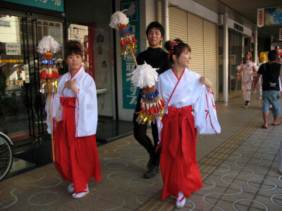 Girls dressed as shrine staff