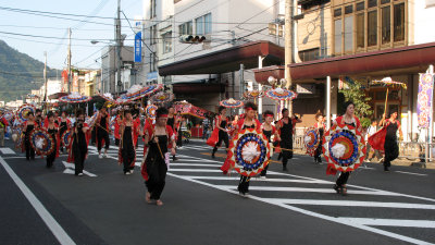 Another group of dancers runs up