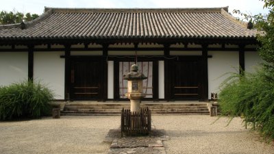 Stone lantern and main hall of Shin Yakushi-ji