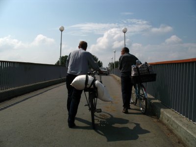 Wheeling bikes across the footbridge