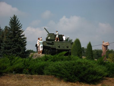 Family playing on the tank