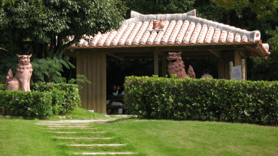 Little pavilion flanked by shīsā