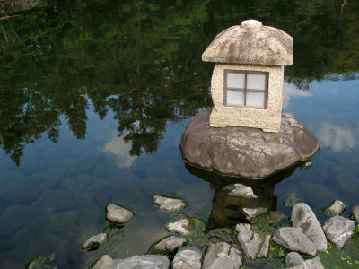 Stone lantern at the pond's edge