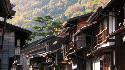 Narai's old machiya against the autumn hills