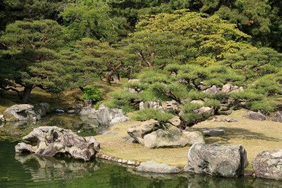 Sculpted trees upon an islet in Kansui-chi