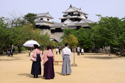 Locals in traditional dress on the castle grounds