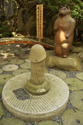 Phallus and bear (tanuki?) statue, Taga-jinja