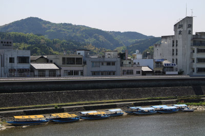 Ukai (cormorant fishing) boats lining the riverbank