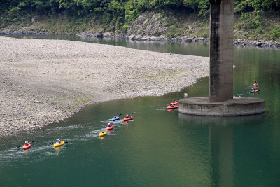 Group kayaking down the Shimanto River