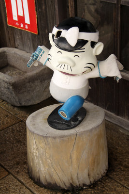 Rather banged-up cartoon doctor statue