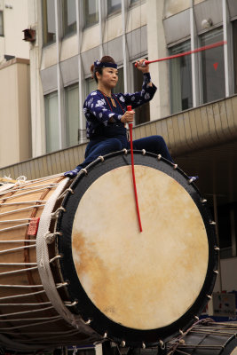 Woman astride a taiko drum