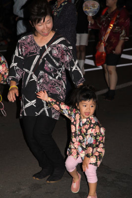 Mother and young daughter dancing