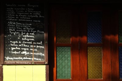 French restaurant menu and colorful door