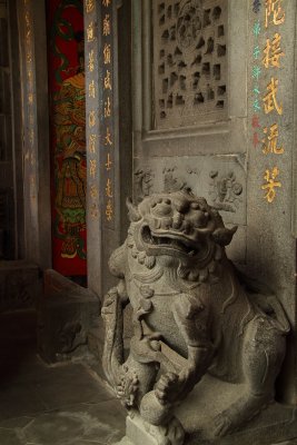 Stone lion at the entrance to Longshan Temple