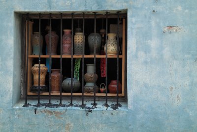 Pottery in an old window