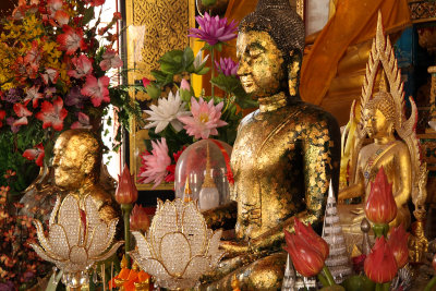 Buddha images and assorted flowers
