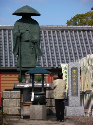 Local man praying at a lesser shrine