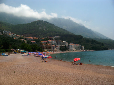 Sveti Stefan beachfront and looming mountains