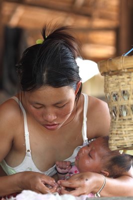 Akha woman and baby Luang Namtha province. 