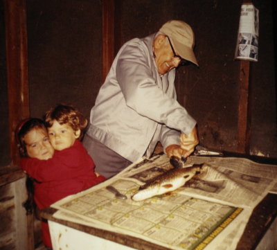 Em, me and grandpa cleaning and gutting the fishes