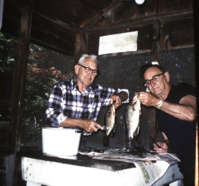 Grandpa and Uncle Johnny cleaning fish up north